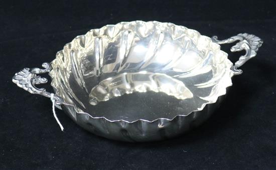 A late 19th/early 20th century silver two handled strawberry dish by Charles Edwards, London, 7 oz.